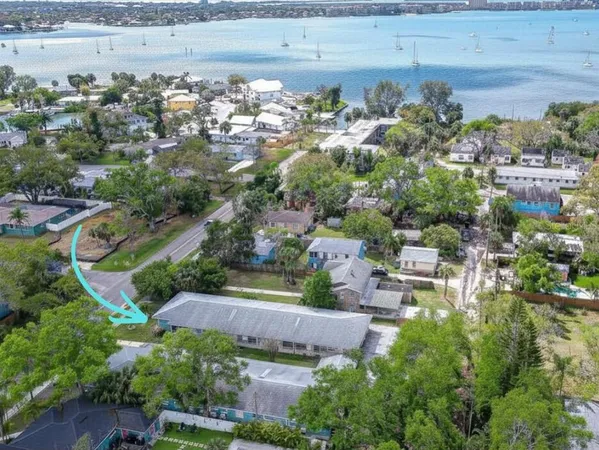 an aerial view of residential house with outdoor space