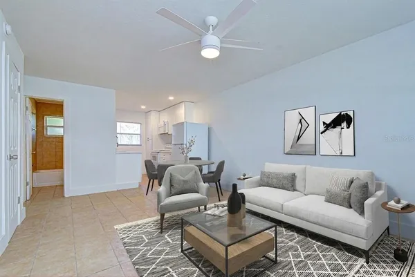 a living room with furniture and a window