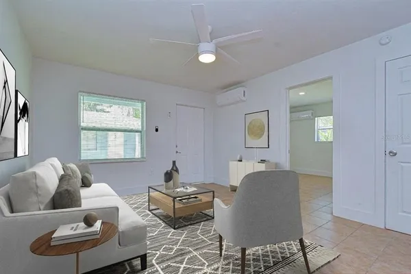 a living room with furniture and a window