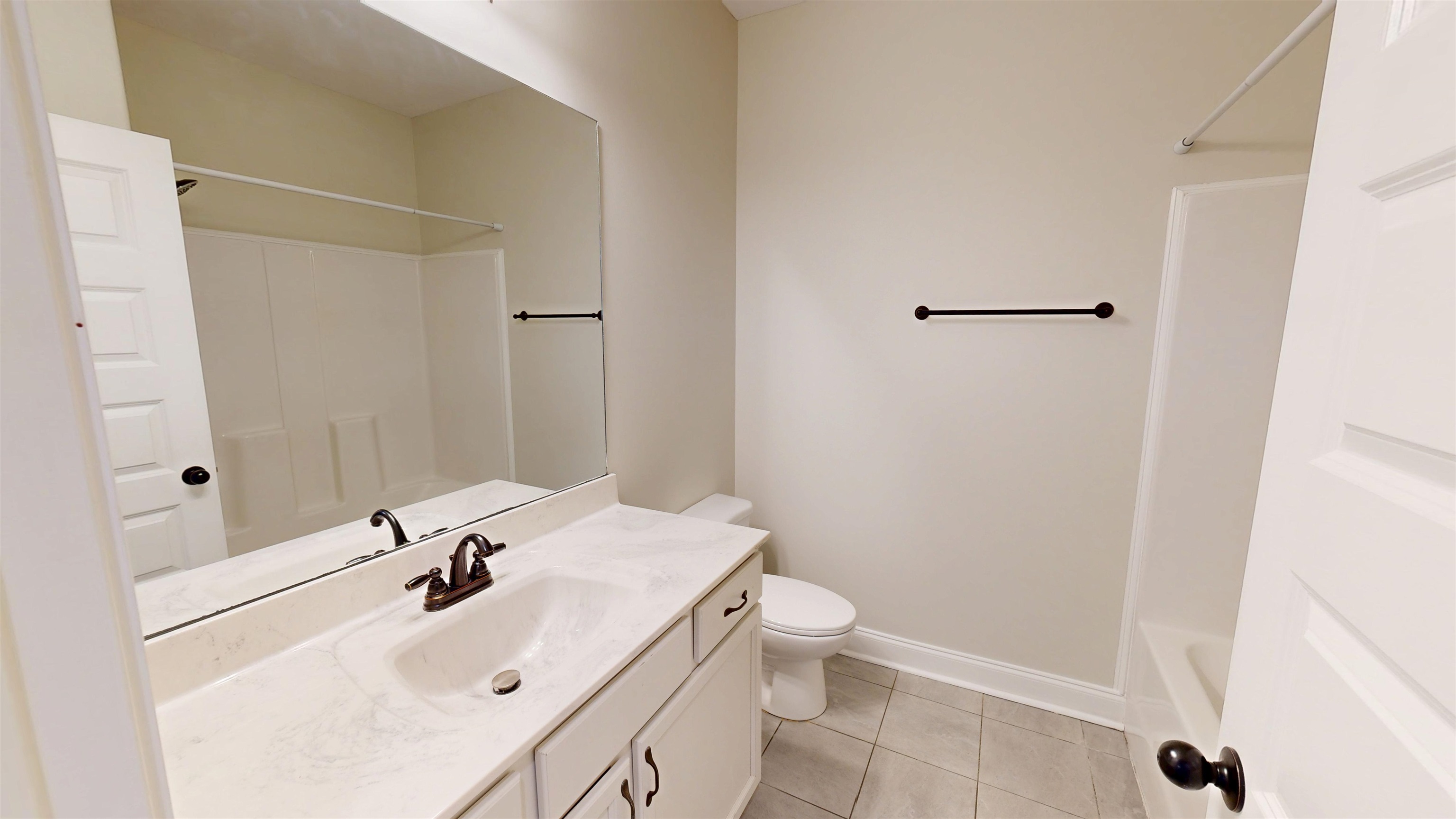 5217 Nail Road Olive Branch, MS 38654 - Photo 23 of 35 Full bathroom with shower / bathtub combination, light tile patterned floors, and vanity