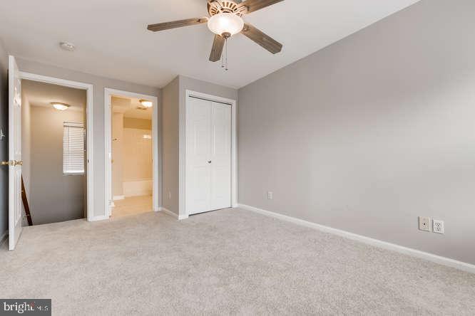 768 Carroll Street Baltimore, MD 21230 - Photo 19 of 26 an empty room with closet and a chandelier fan