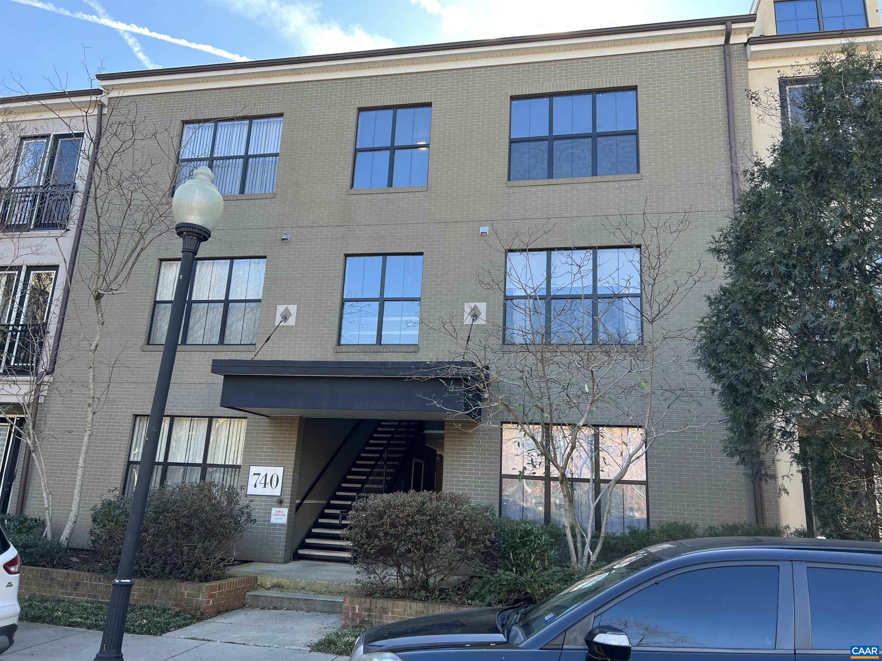 740 Walker Square, Unit 3A Charlottesville, VA 22903 - Photo 1 of 29 a front view of a house with garden