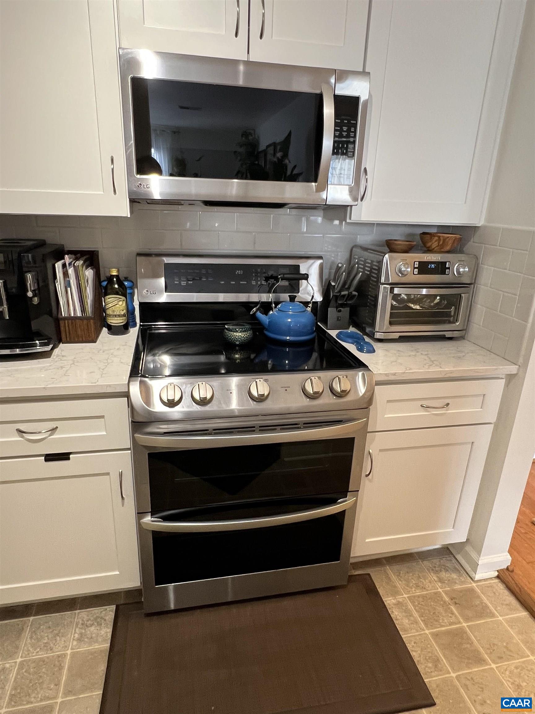 740 Walker Square, Unit 3A Charlottesville, VA 22903 - Photo 12 of 29 a stove top oven sitting inside of a kitchen