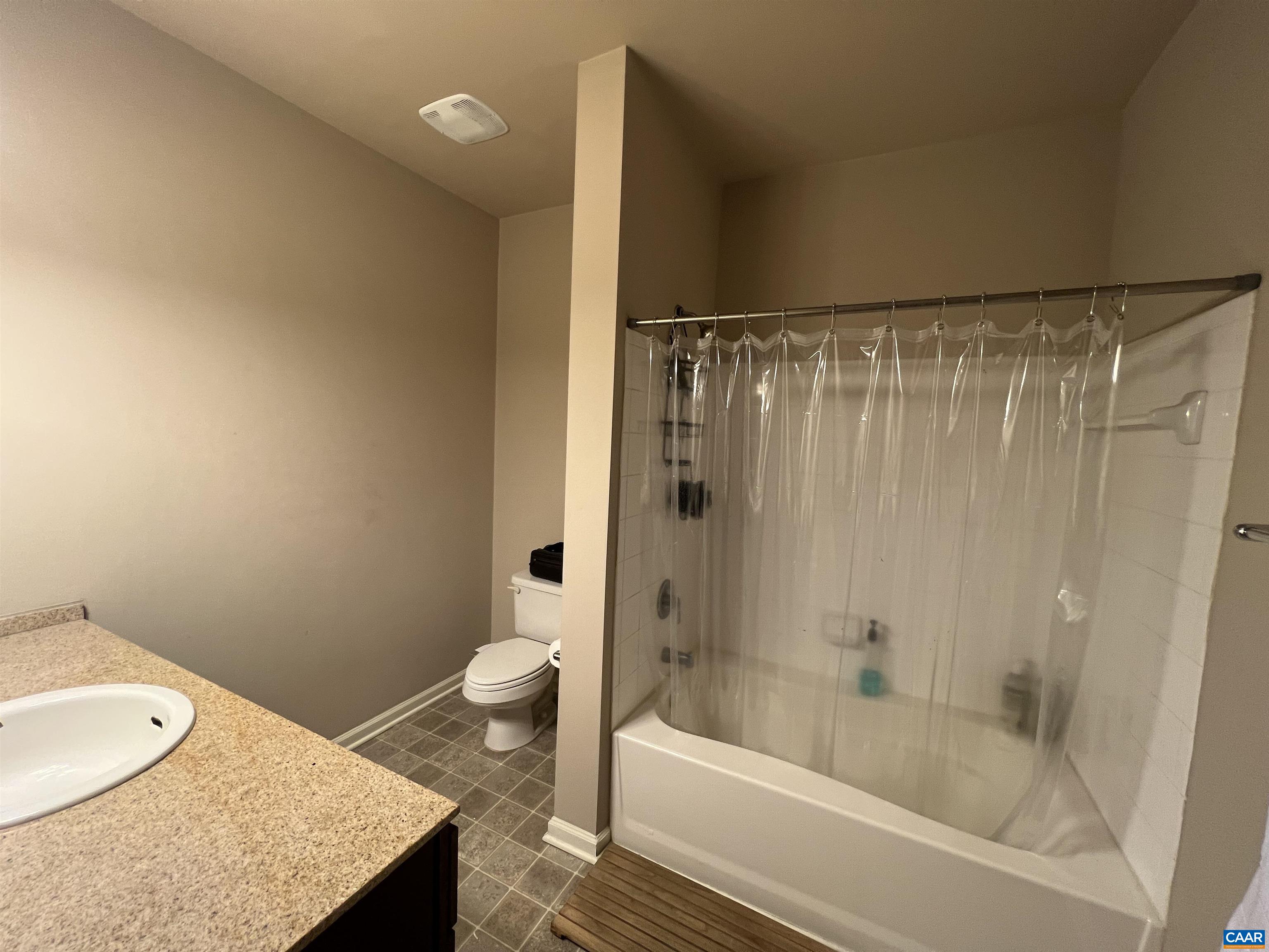 740 Walker Square, Unit 3A Charlottesville, VA 22903 - Photo 17 of 29 a bathroom with a granite countertop sink toilet and shower