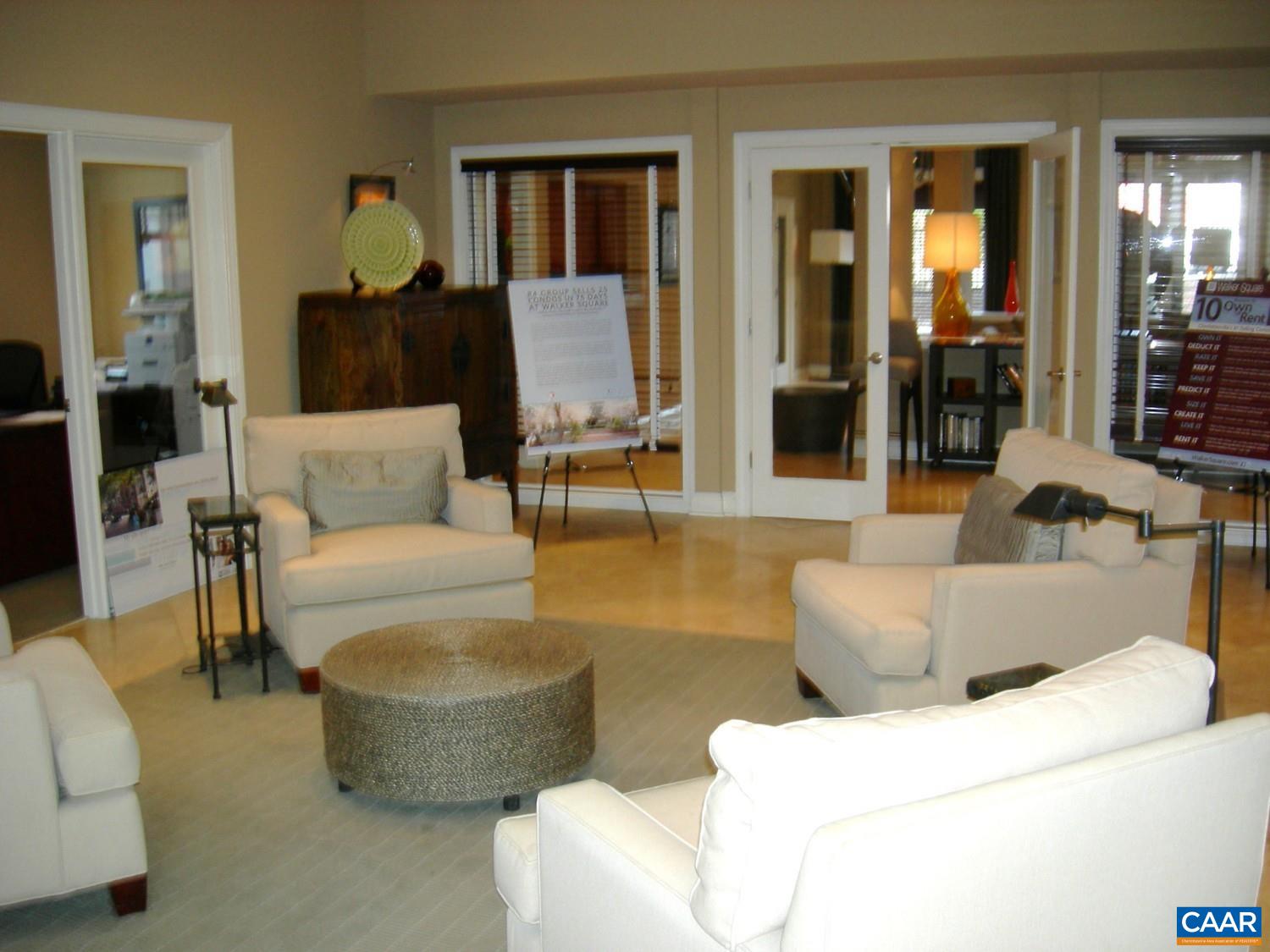 740 Walker Square, Unit 3A Charlottesville, VA 22903 - Photo 23 of 29 a living room with furniture and a potted plant