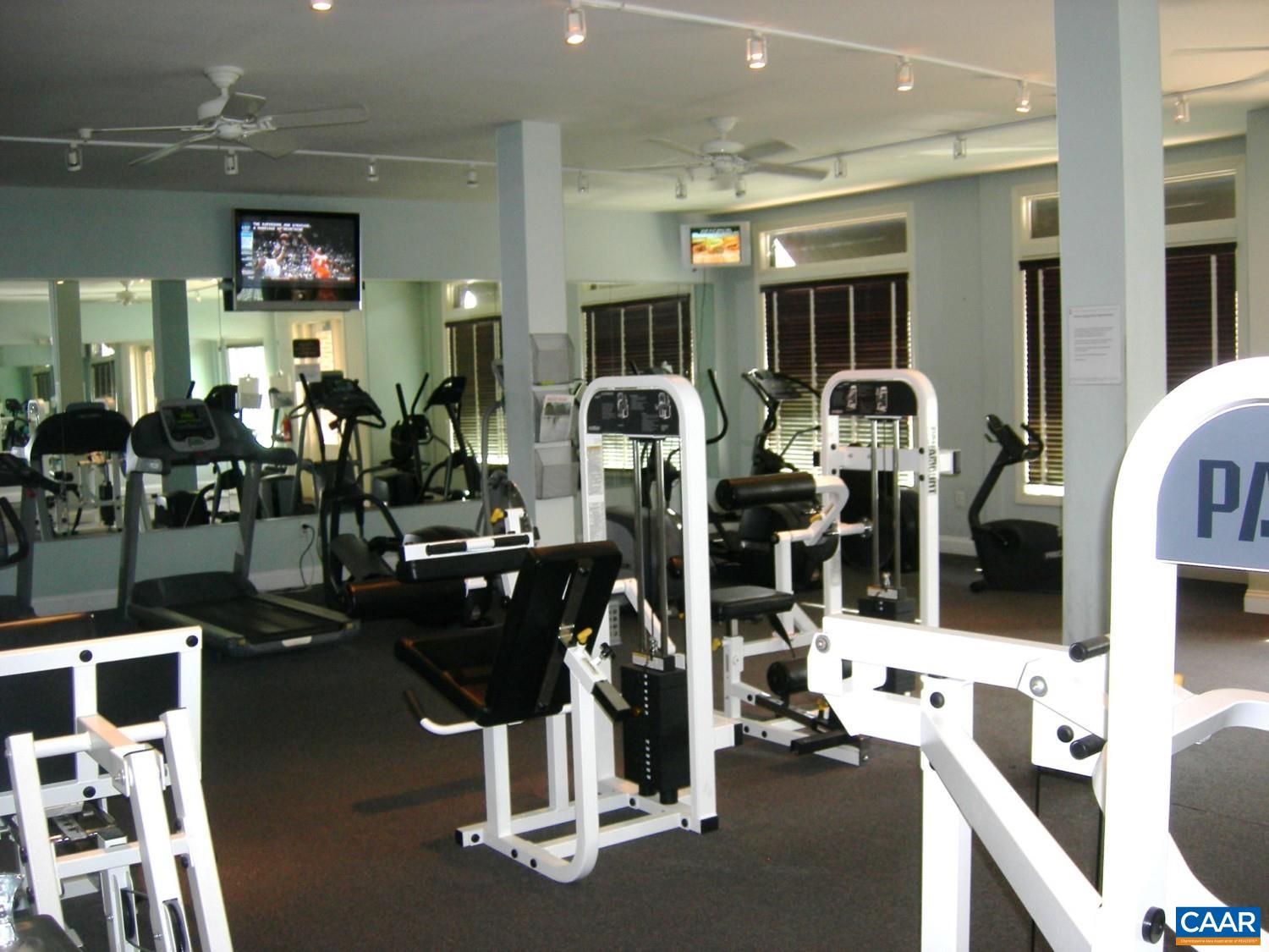 740 Walker Square, Unit 3A Charlottesville, VA 22903 - Photo 25 of 29 a room with gym equipment and large mirror