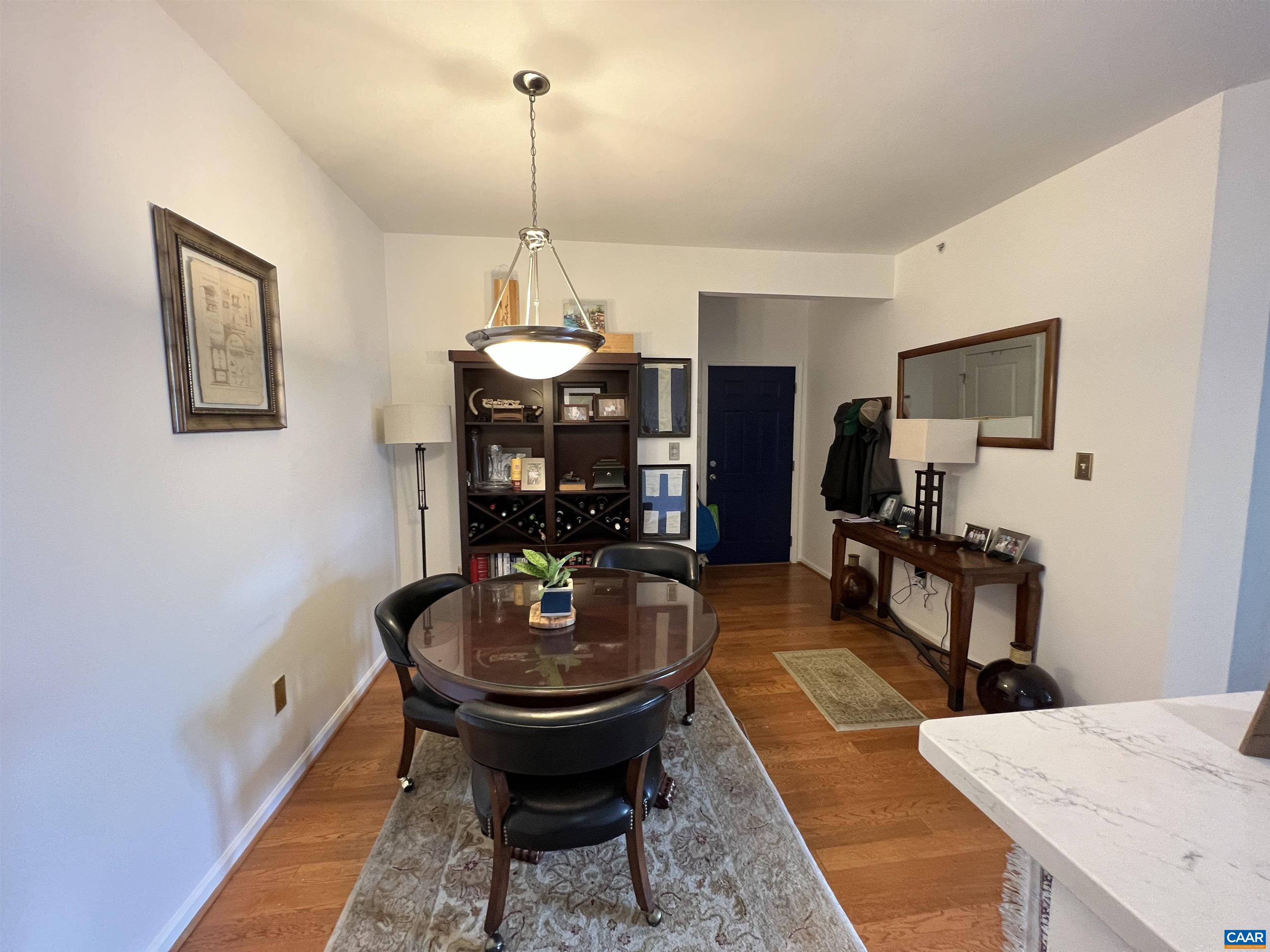 740 Walker Square, Unit 3A Charlottesville, VA 22903 - Photo 6 of 29 a living room with furniture and a chandelier