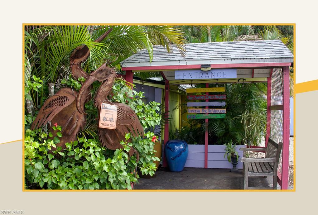 3724 Grove Circle Naples, FL 34112 - Photo 10 of 14 a view of an outdoor sitting area with brick walls