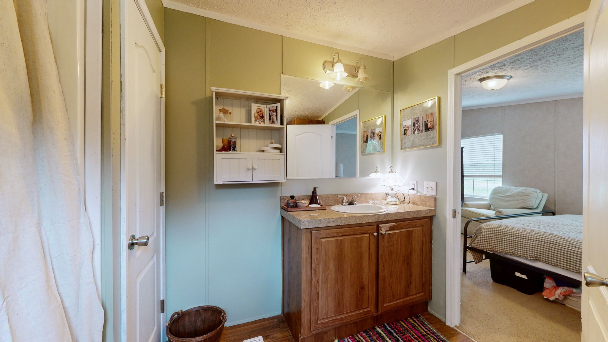 133 Cleveland Road Wartrace, TN 37183 - Photo 15 of 23 a en suite bathroom with a sink and a mirror