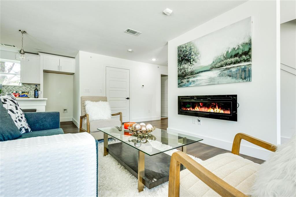 2011 Kirby Street, Unit 104 Dallas, TX 75204 - Photo 10 of 32 a living room with furniture and a flat screen tv