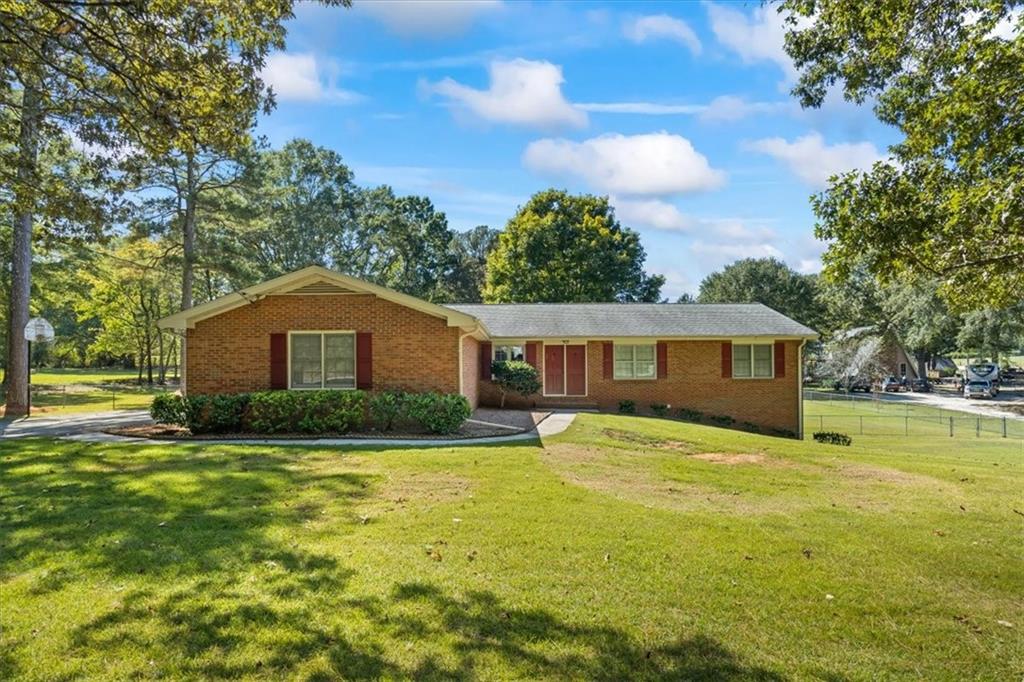a front view of a house with a yard