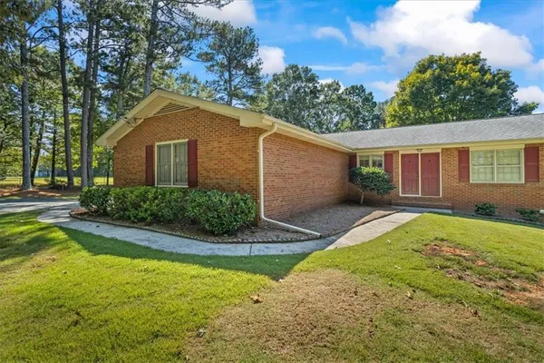 a house view with a garden space