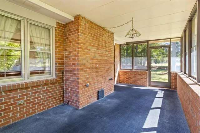 a view of an empty room with a balcony