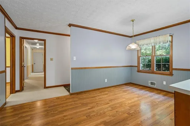 a view of room with window and ceiling fan