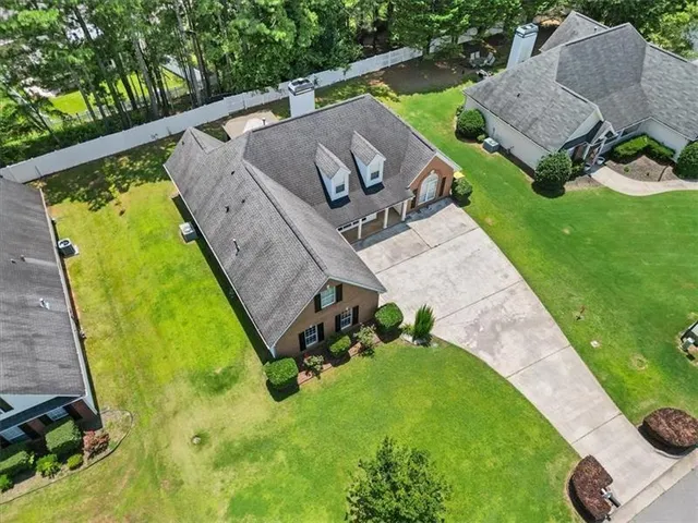 a view of a backyard with sitting area