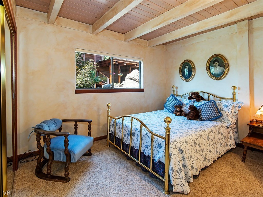 816 Toni Court Incline Village, NV 89451 - Photo 16 of 22 a bedroom with a bed and a table in it