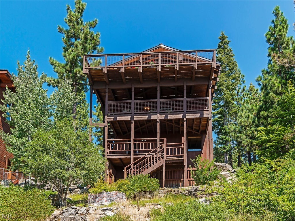 816 Toni Court Incline Village, NV 89451 - Photo 22 of 22 a view of a wooden door with a bench and potted plants
