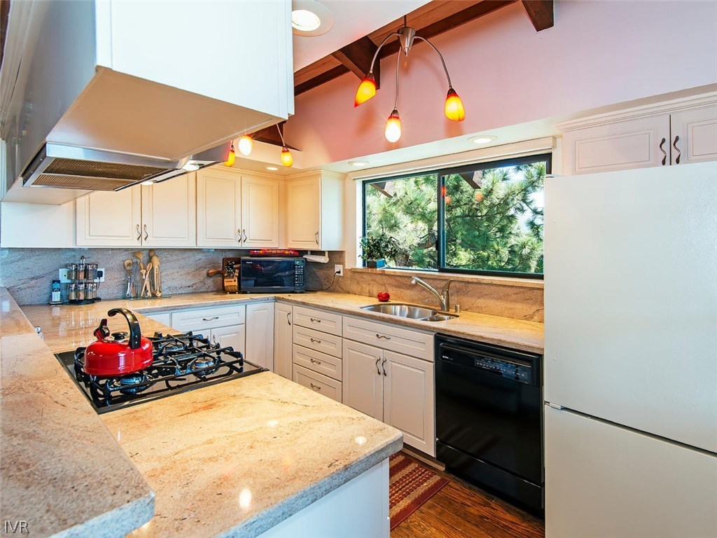 816 Toni Court Incline Village, NV 89451 - Photo 9 of 22 a kitchen with a stove a sink and a refrigerator