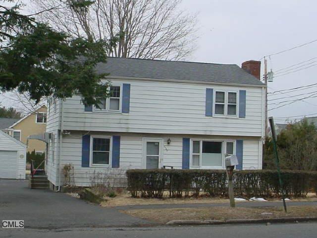 a front view of a house with yard