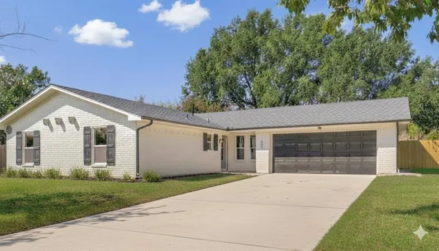 a view of house with yard