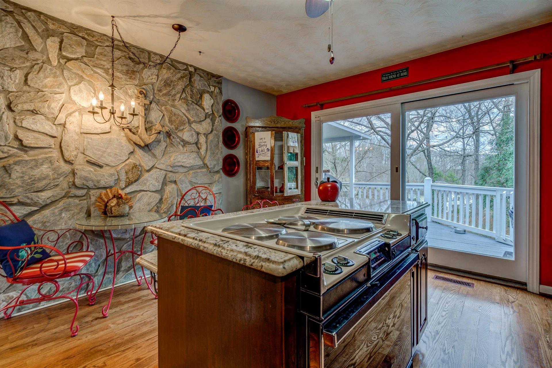 51 Cedar Ridge Circle Union Hall, VA 24176 - Photo 22 of 63 a open kitchen with stainless steel appliances granite countertop a stove and a wooden floors
