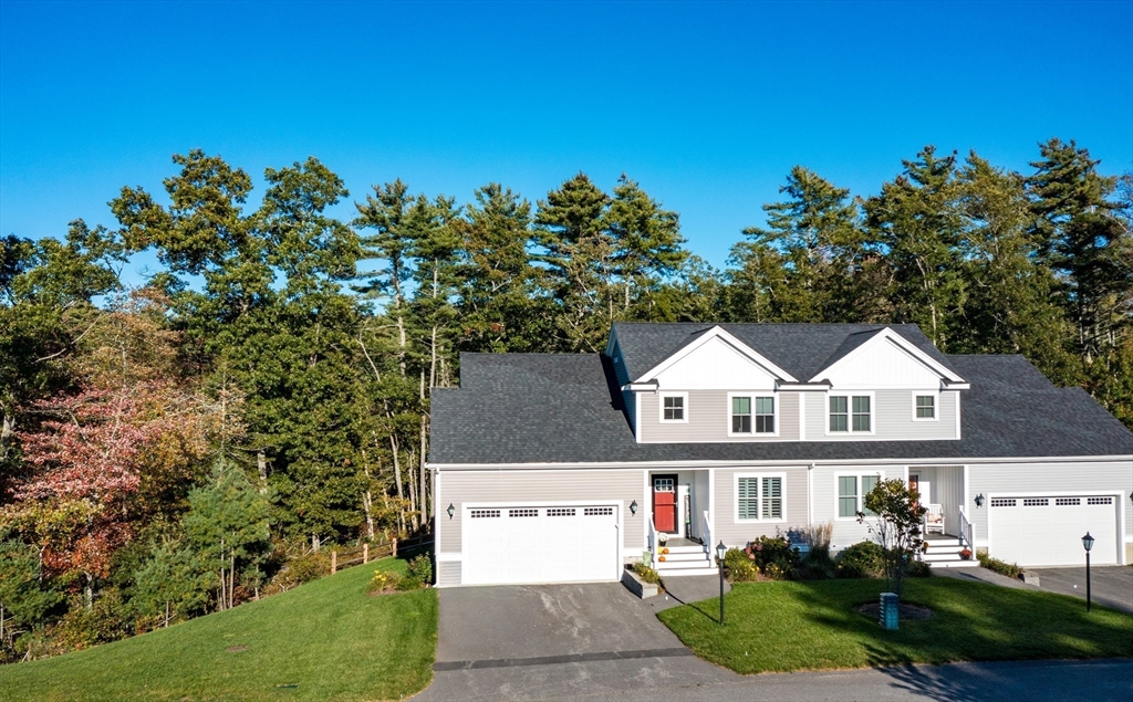 19 Sarahbeth Lane, Unit 27 Rochester, MA 02770 - Photo 1 of 37 a view of house with outdoor space