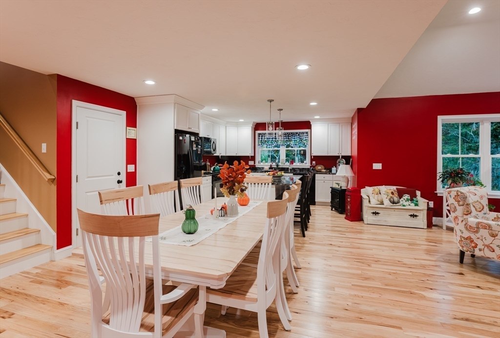 19 Sarahbeth Lane, Unit 27 Rochester, MA 02770 - Photo 20 of 37 a dining room with furniture and wooden floor