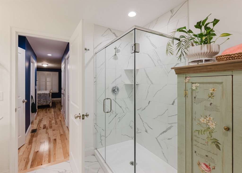 19 Sarahbeth Lane, Unit 27 Rochester, MA 02770 - Photo 23 of 37 a bathroom with a shower and a shower