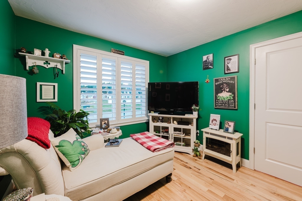 19 Sarahbeth Lane, Unit 27 Rochester, MA 02770 - Photo 26 of 37 a bedroom with furniture and a flat screen tv