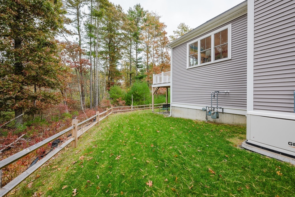 19 Sarahbeth Lane, Unit 27 Rochester, MA 02770 - Photo 6 of 37 a view of backyard with green space