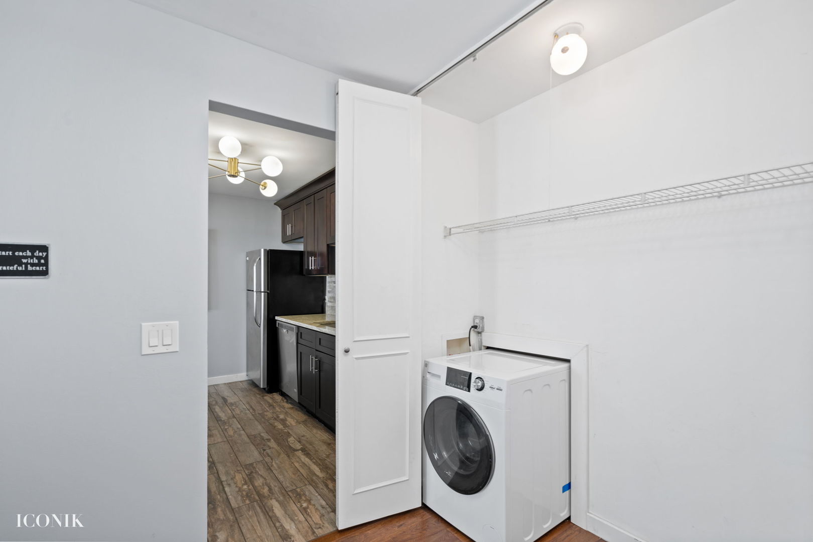 200 North Dearborn Street, Unit 1007 Chicago, IL 60601 - Photo 12 of 18 a view of kitchen and washer and dryer