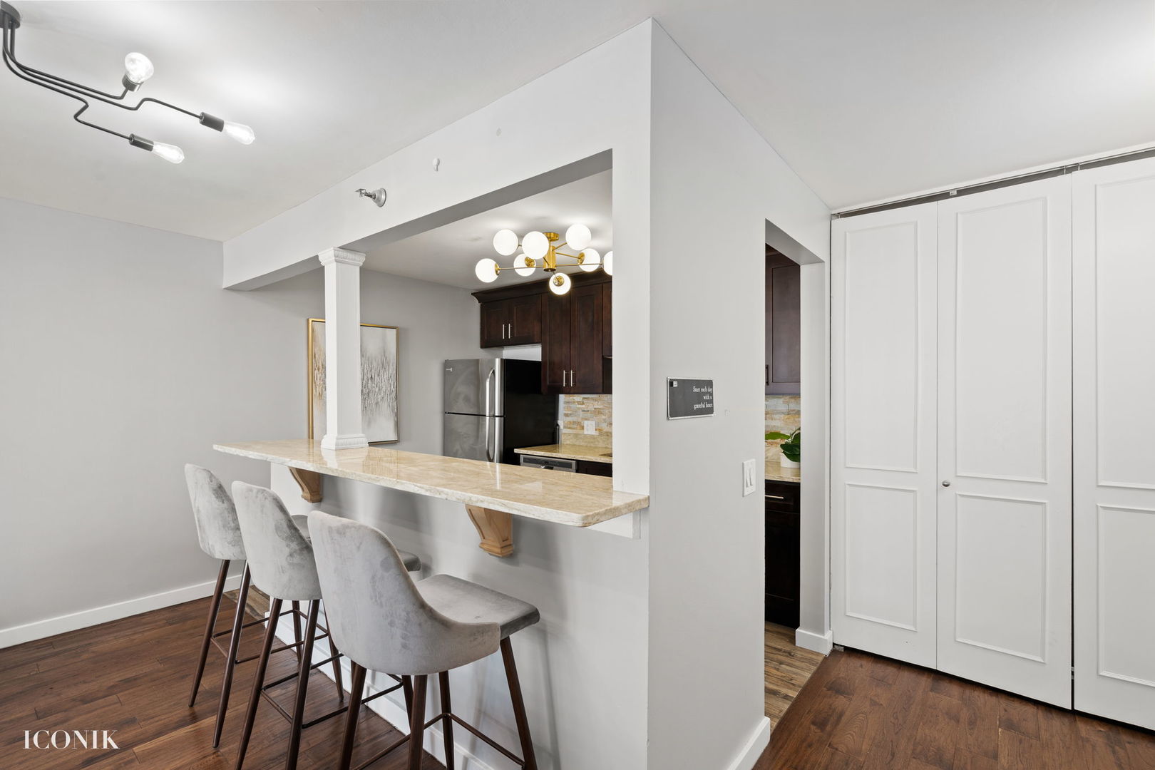 200 North Dearborn Street, Unit 1007 Chicago, IL 60601 - Photo 5 of 18 a view of a dining room with furniture and wooden floor