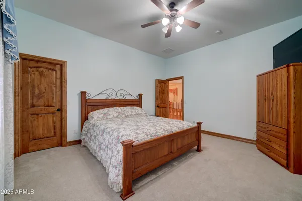 a bed sitting in a bedroom and closet