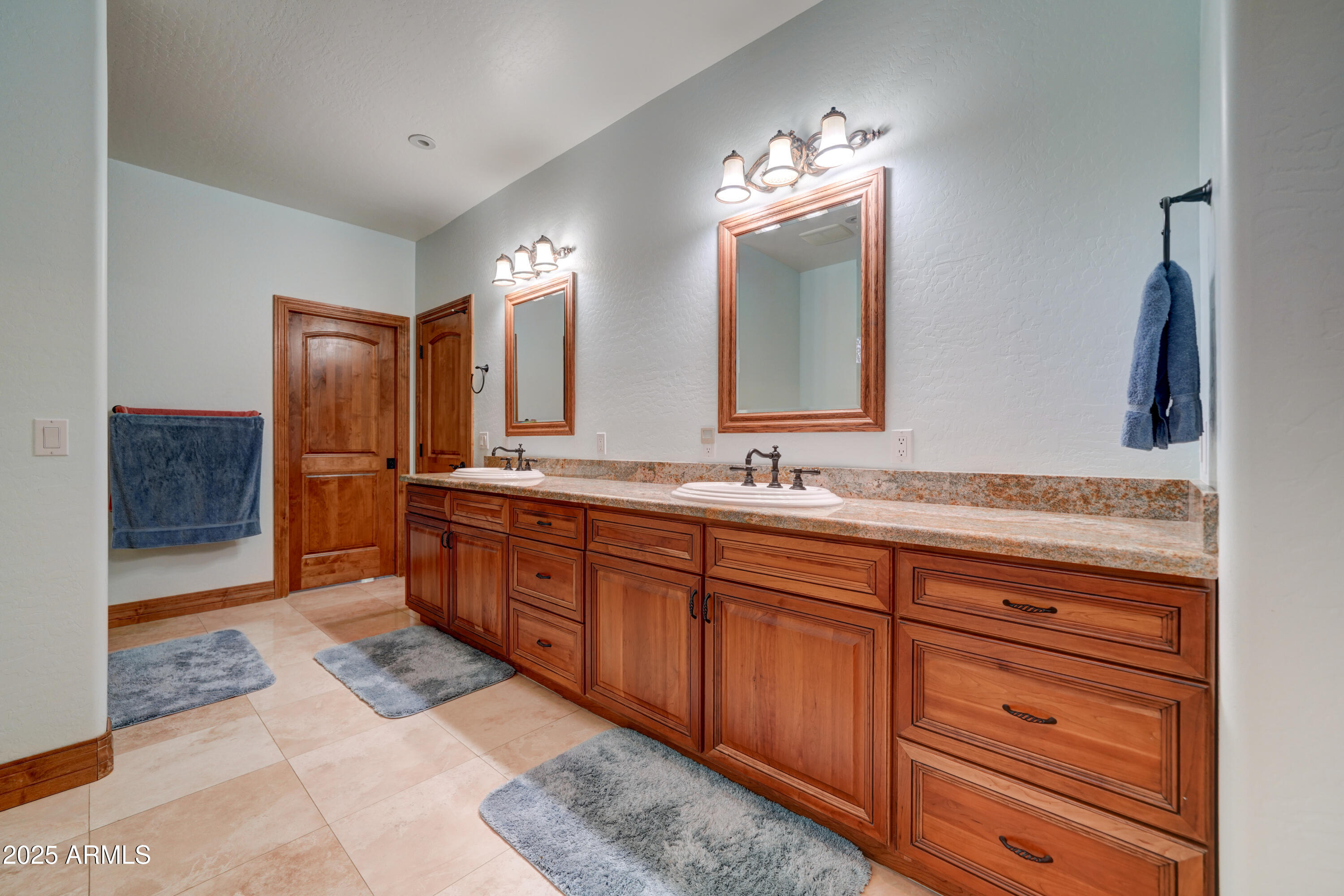 424 East Lehi Road Mesa, AZ 85203 - Photo 19 of 35 a spacious bathroom with double vanity and a mirror