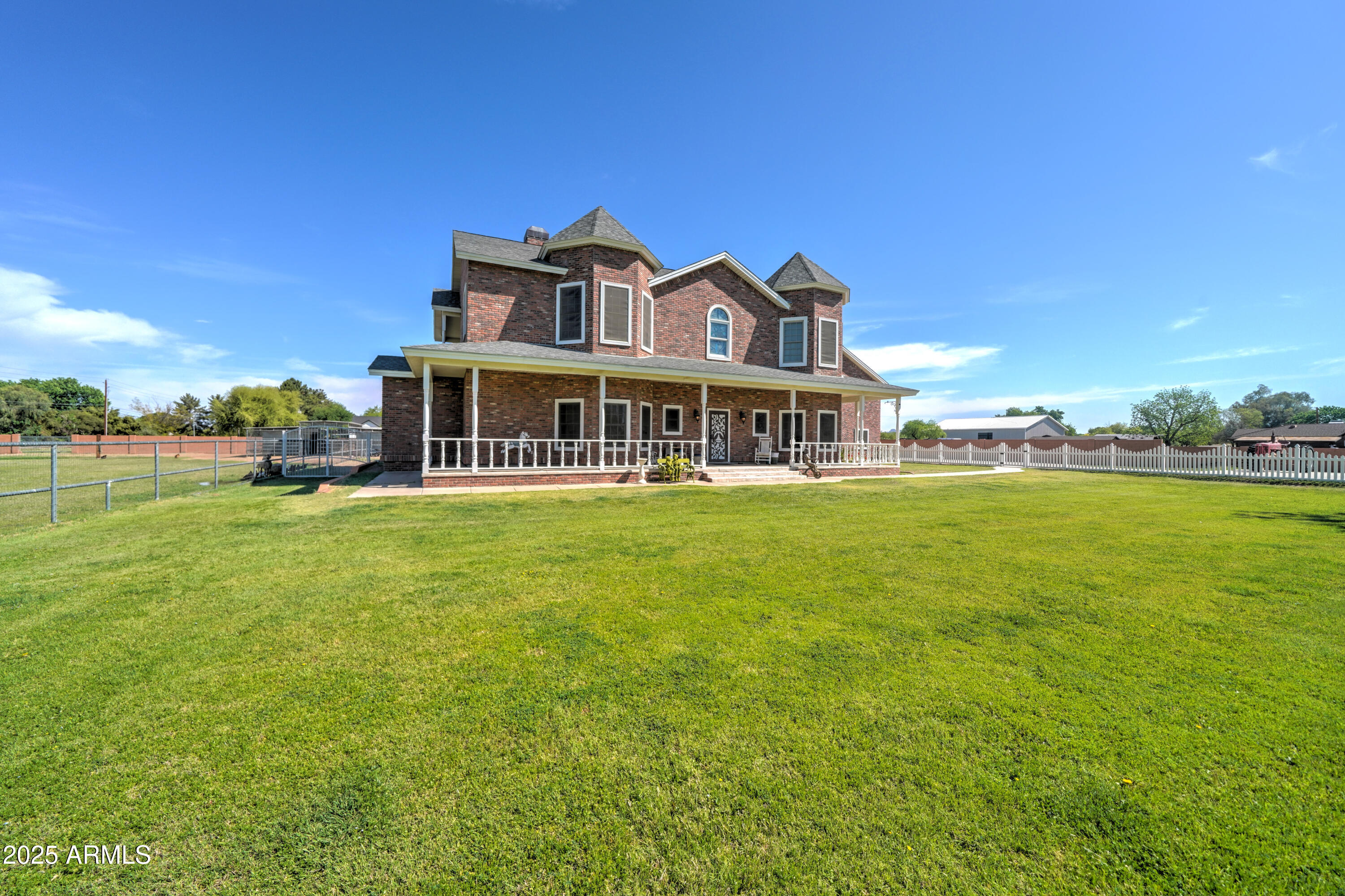 424 East Lehi Road Mesa, AZ 85203 - Photo 2 of 35 a front view of a building with garden