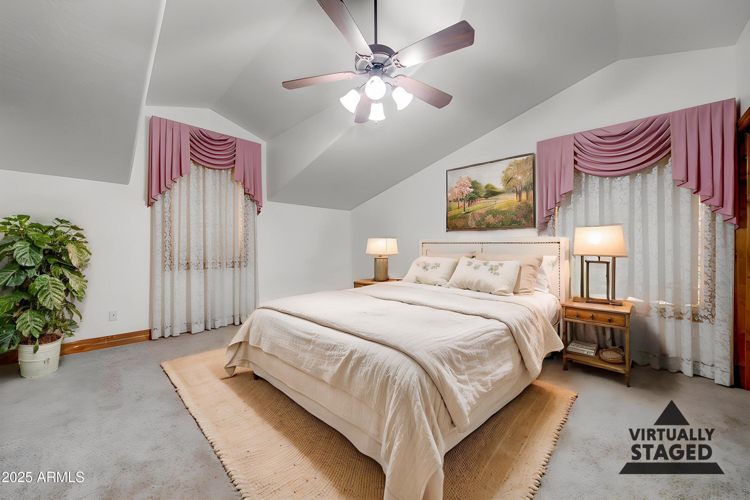 424 East Lehi Road Mesa, AZ 85203 - Photo 27 of 35 a spacious bedroom with a bed and a chandelier