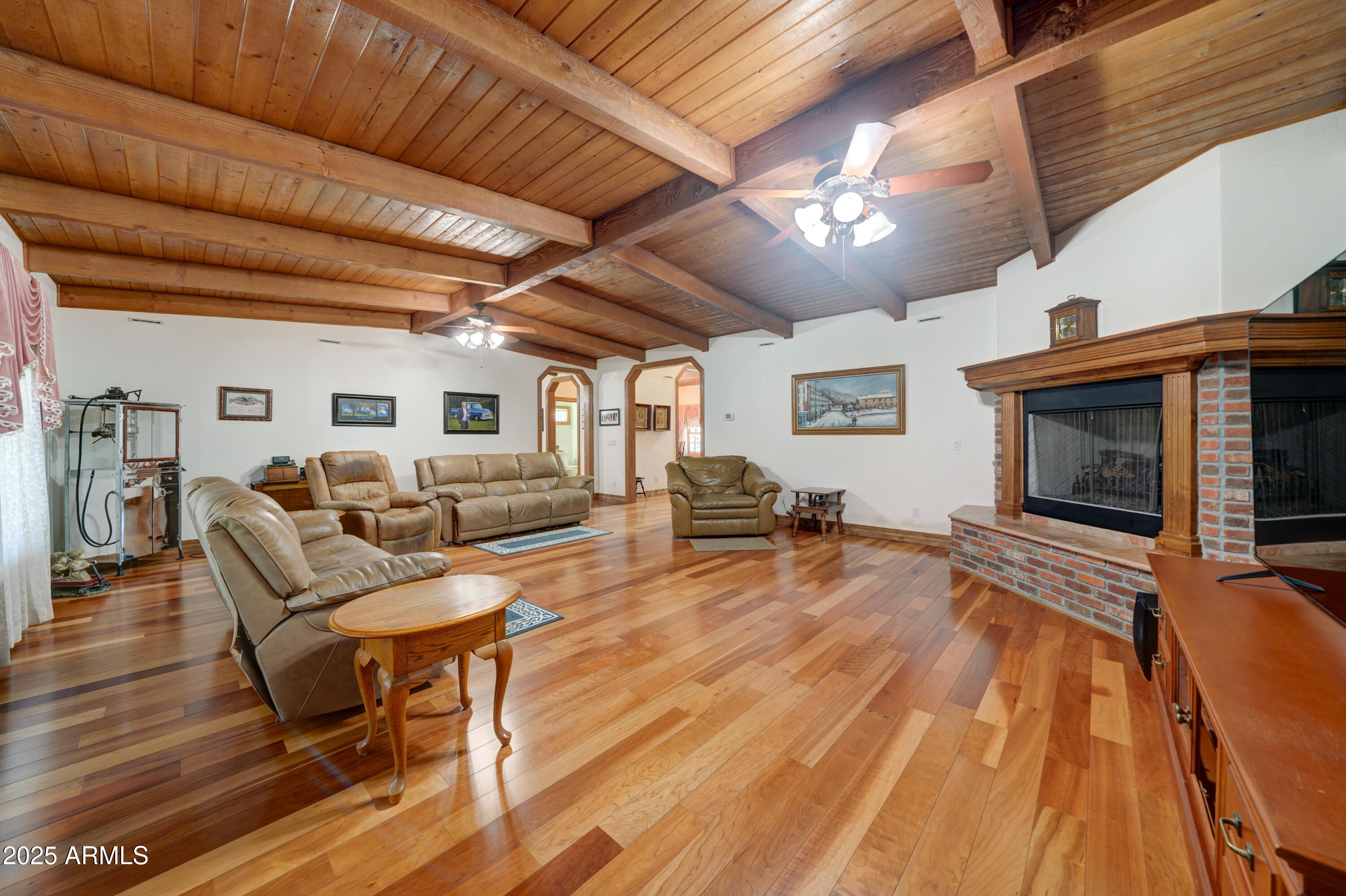 424 East Lehi Road Mesa, AZ 85203 - Photo 8 of 35 a living room with furniture and a fireplace