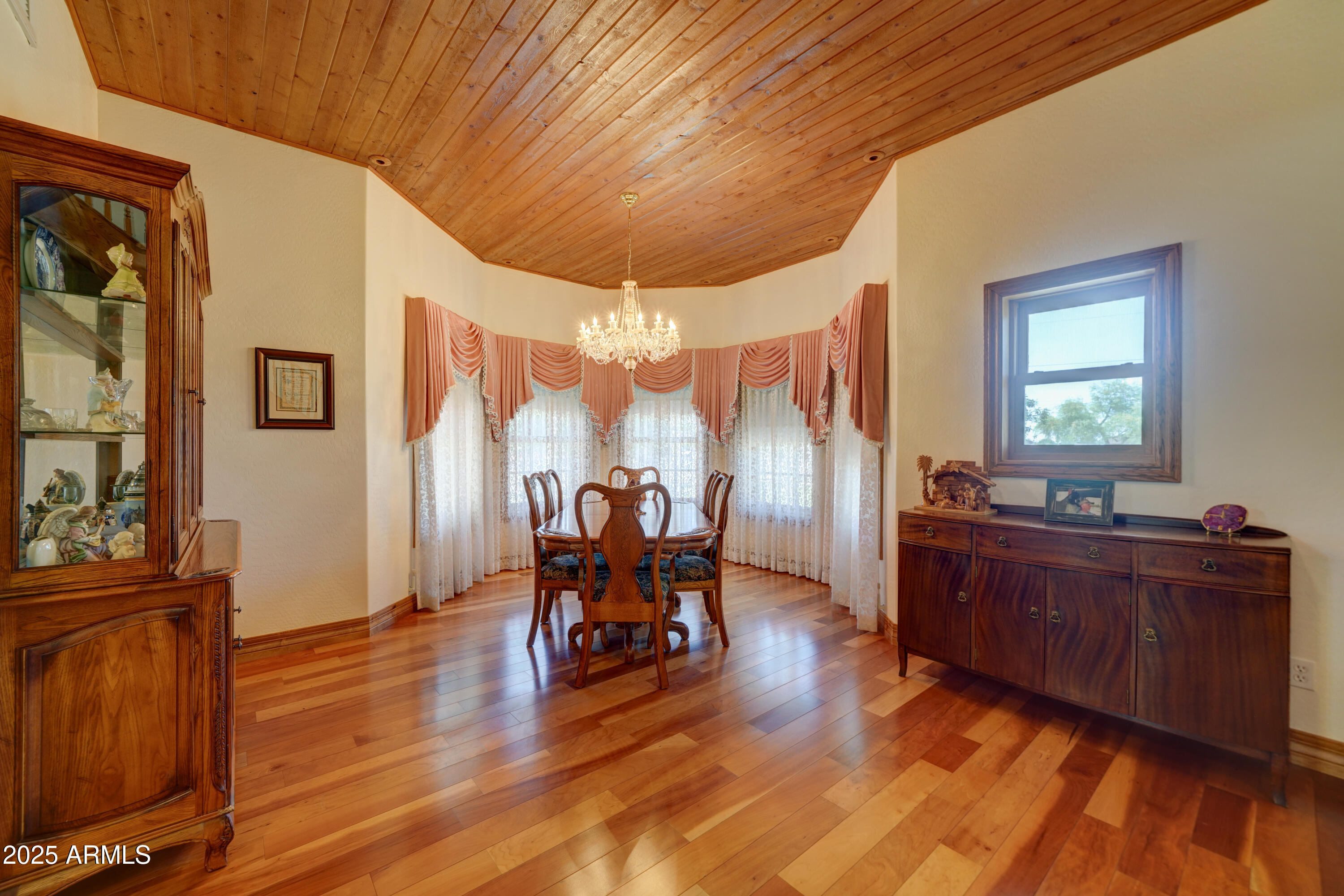 424 East Lehi Road Mesa, AZ 85203 - Photo 9 of 35 a dining room with wooden floor and furniture