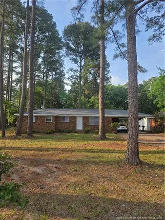 a view of a yard with a tree