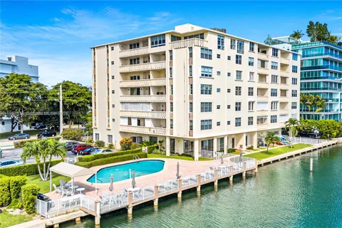 a view of a swimming pool with a lounge chairs