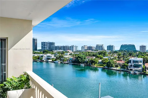 a view of residential house with outdoor space and lake view