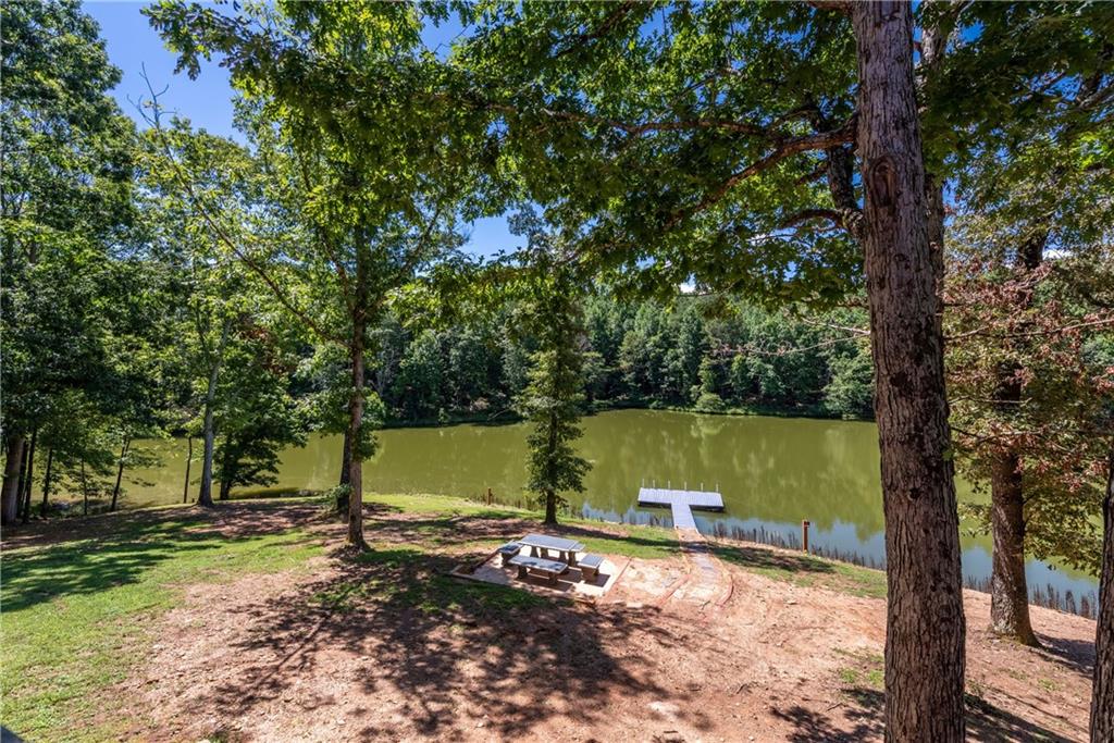 755 Harris Road Jasper, GA 30143 - Photo 38 of 54 a view of a lake with a yard