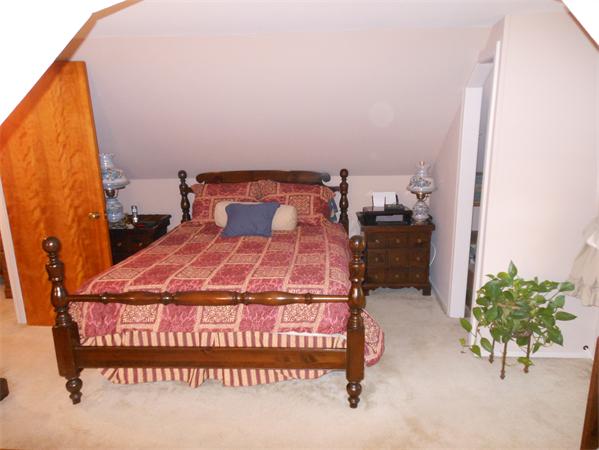 22 Marchioness Road Springfield, MA 01129 - Photo 15 of 27 a bedroom with a bed and a potted plant