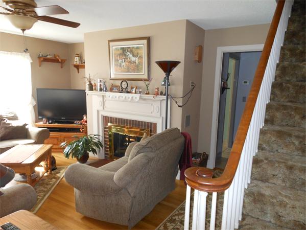 22 Marchioness Road Springfield, MA 01129 - Photo 3 of 27 a living room with furniture a flat screen tv and a fireplace