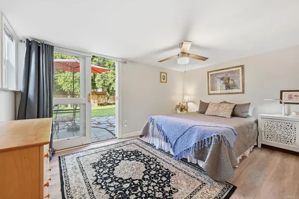 a bedroom with double bed and a window