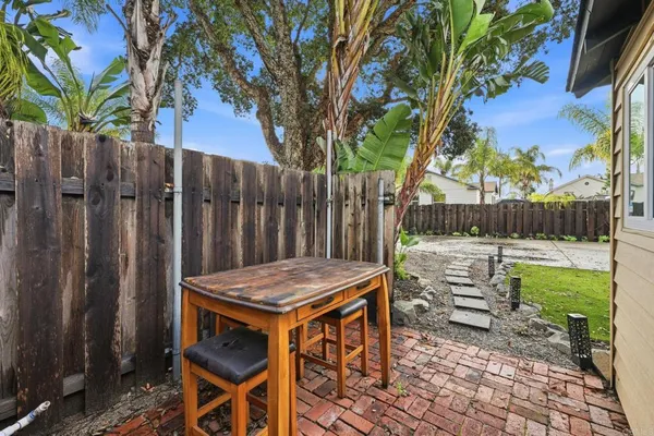 a wooden bench sitting in front of a house