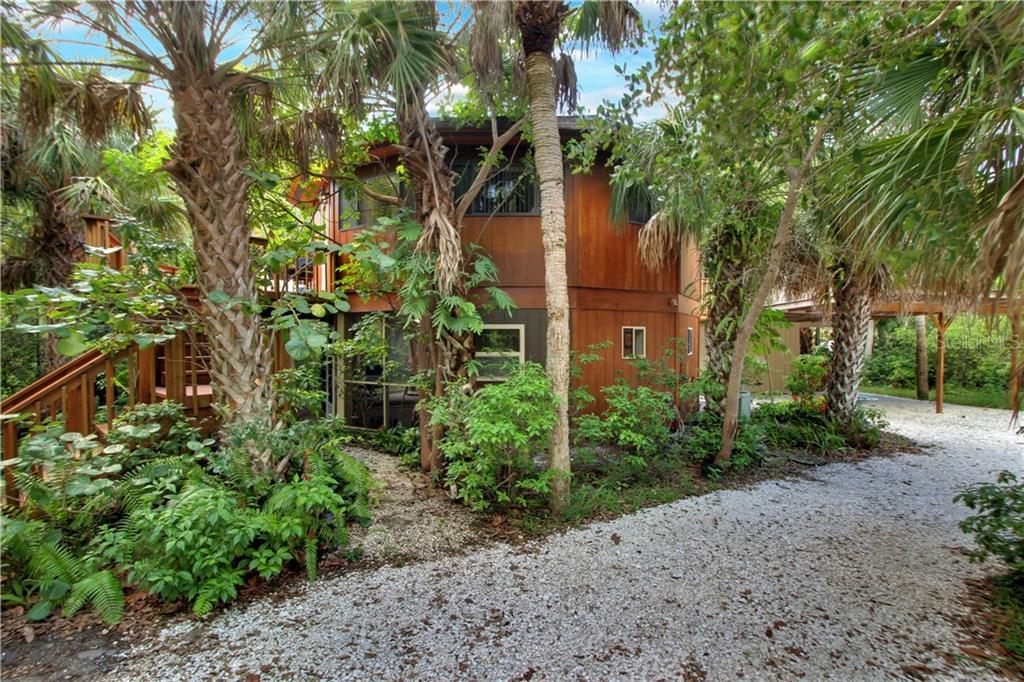 8335 Manasota Key Road Englewood, FL 34223 - Photo 20 of 27 a view of a garden with plants