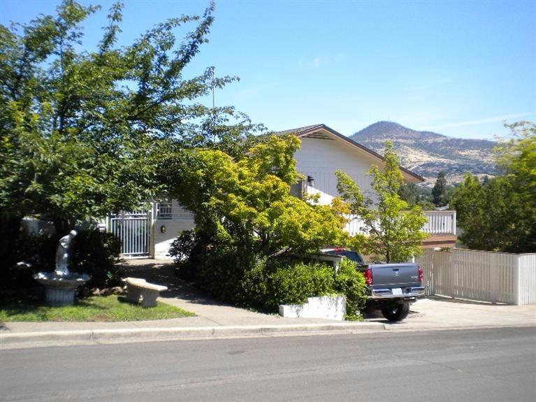 Street side view of home with Roxy Ann i