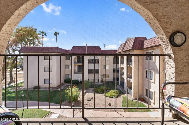 a view of a balcony with a swimming pool