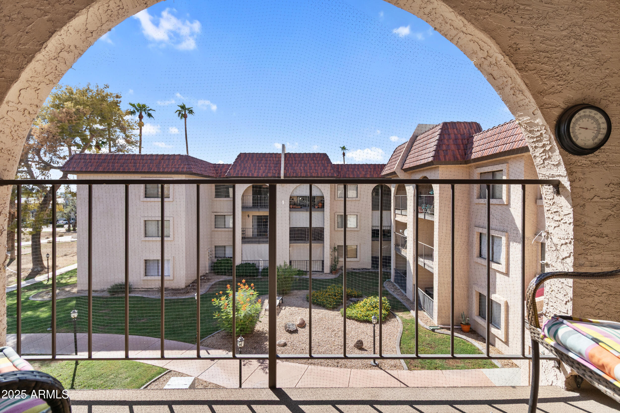 a view of a balcony with a swimming pool